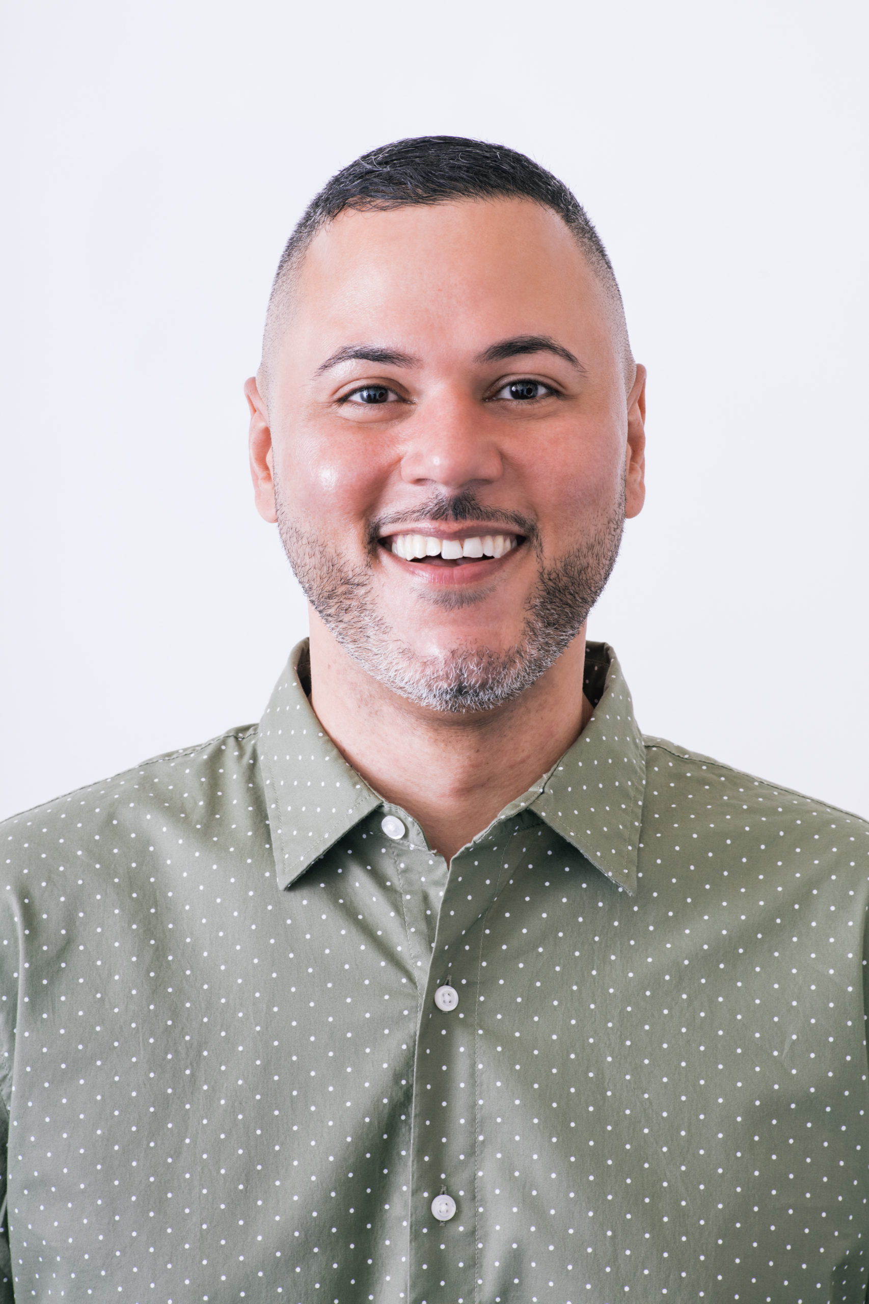 Headshot of Julian smiling